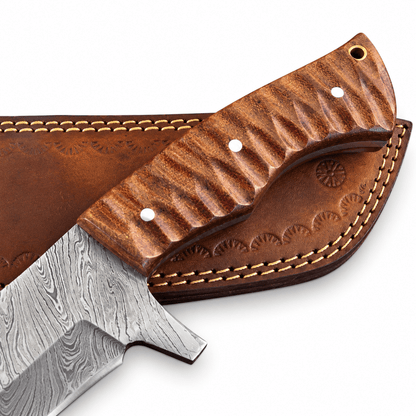 Tooled brown leather sheath with stitching, belt loop and brass snap