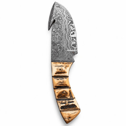 Damascus steel blade with swirling pattern and gut hook near the tip
