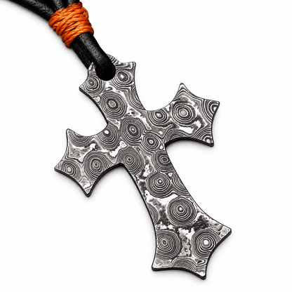 Gothic Damascus steel cross pendant with ringed pattern on black cord