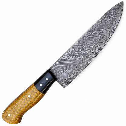 Handmade chef knife with amber honeycomb resin handle and black bolster
