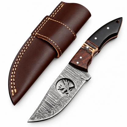 Damascus skinner knife blade with antler silhouette cutout and layered pattern
