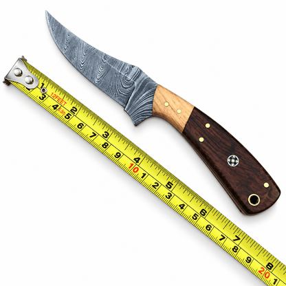 Black embossed leather sheath with tan cord stitching beside a small fixed blade knife