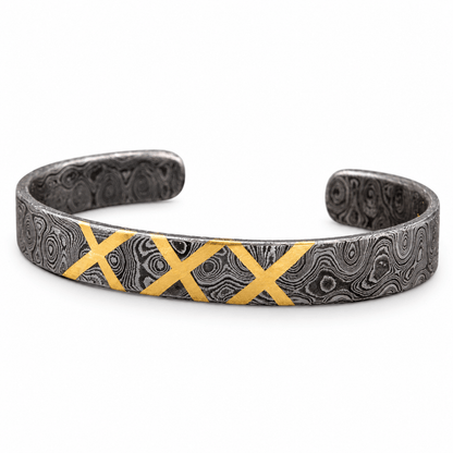 Close view of brass X inlay set into Damascus steel band