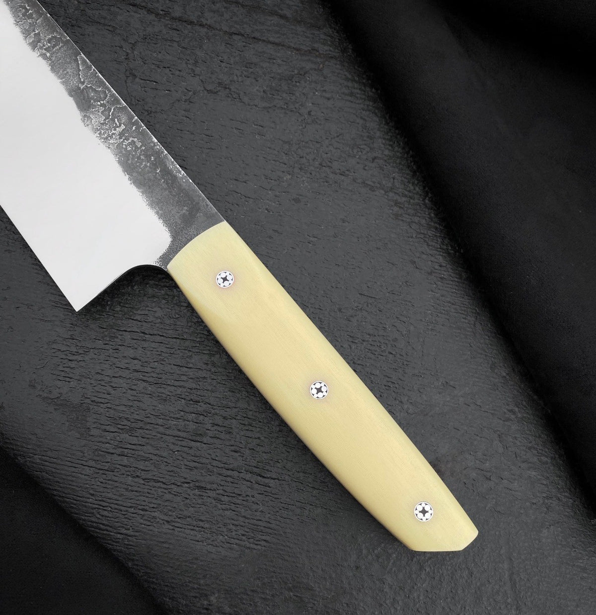 Camel bone knife handle with three small round pins

