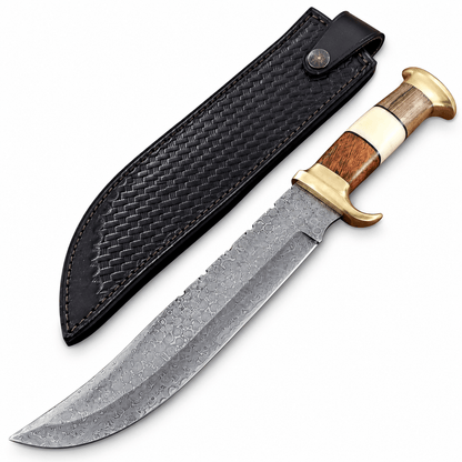 Damascus Bowie with brass fittings resting on its leather sheath