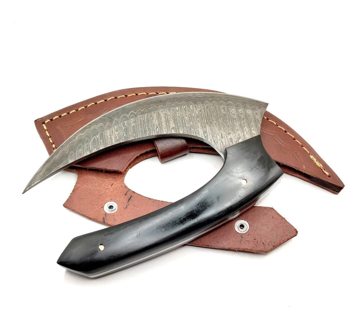 Damascus steel ulu knife showing the layered blade pattern
