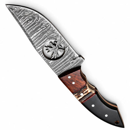 Brown stitched leather sheath beside a 7 inch Damascus skinning knife