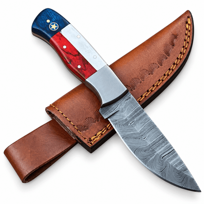 Fixed blade skinning knife with lone star pin on a blue handle section
