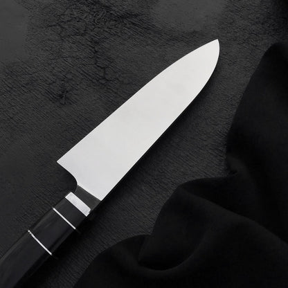 Handmade 7 inch chef knife with wide polished stainless steel blade and straight spine
