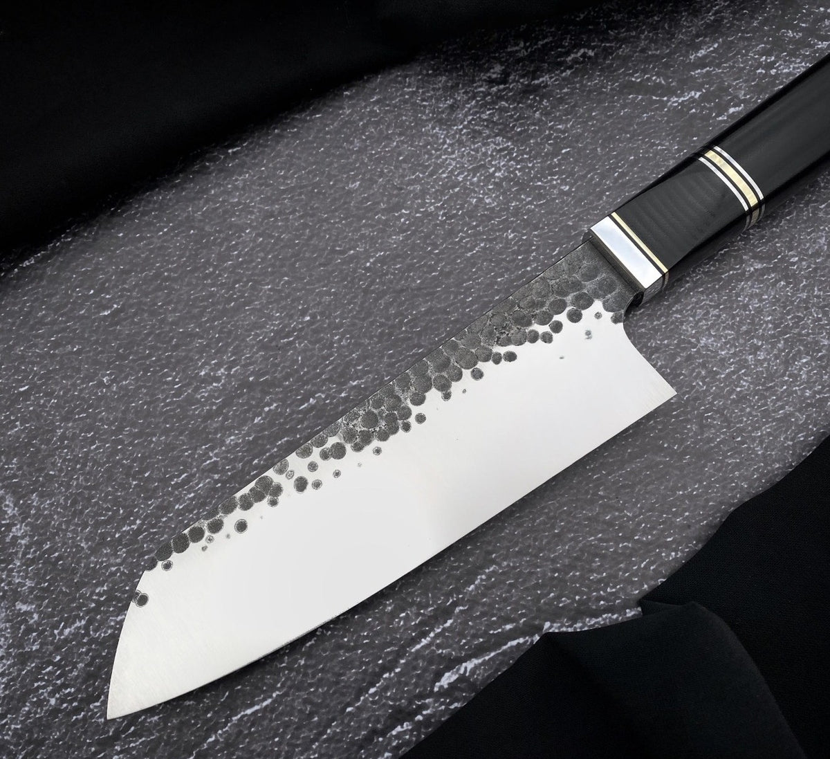 Handmade 7 inch kitchen knife with dimpled hammered finish and polished edge face
