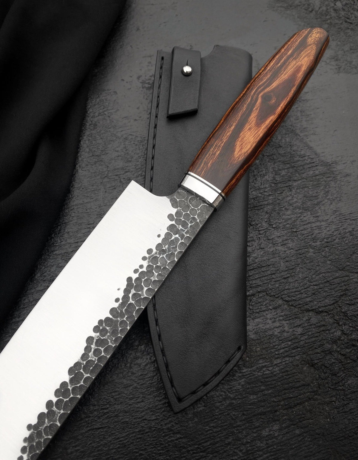 Handmade 8 inch kitchen knife with hammered spine side and polished edge face
