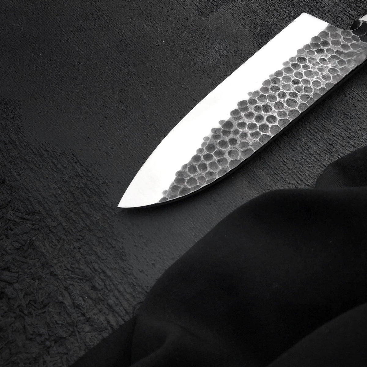 Handmade 7 inch stainless steel kitchen knife with textured hammered blade face

