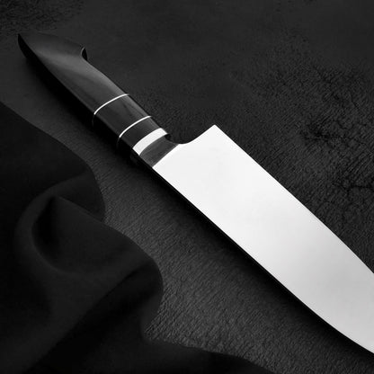 Black Micarta chef knife handle with two thin light spacers
