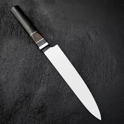 Octagonal knife handle with black Micarta, dark wood section and thin light spacers
