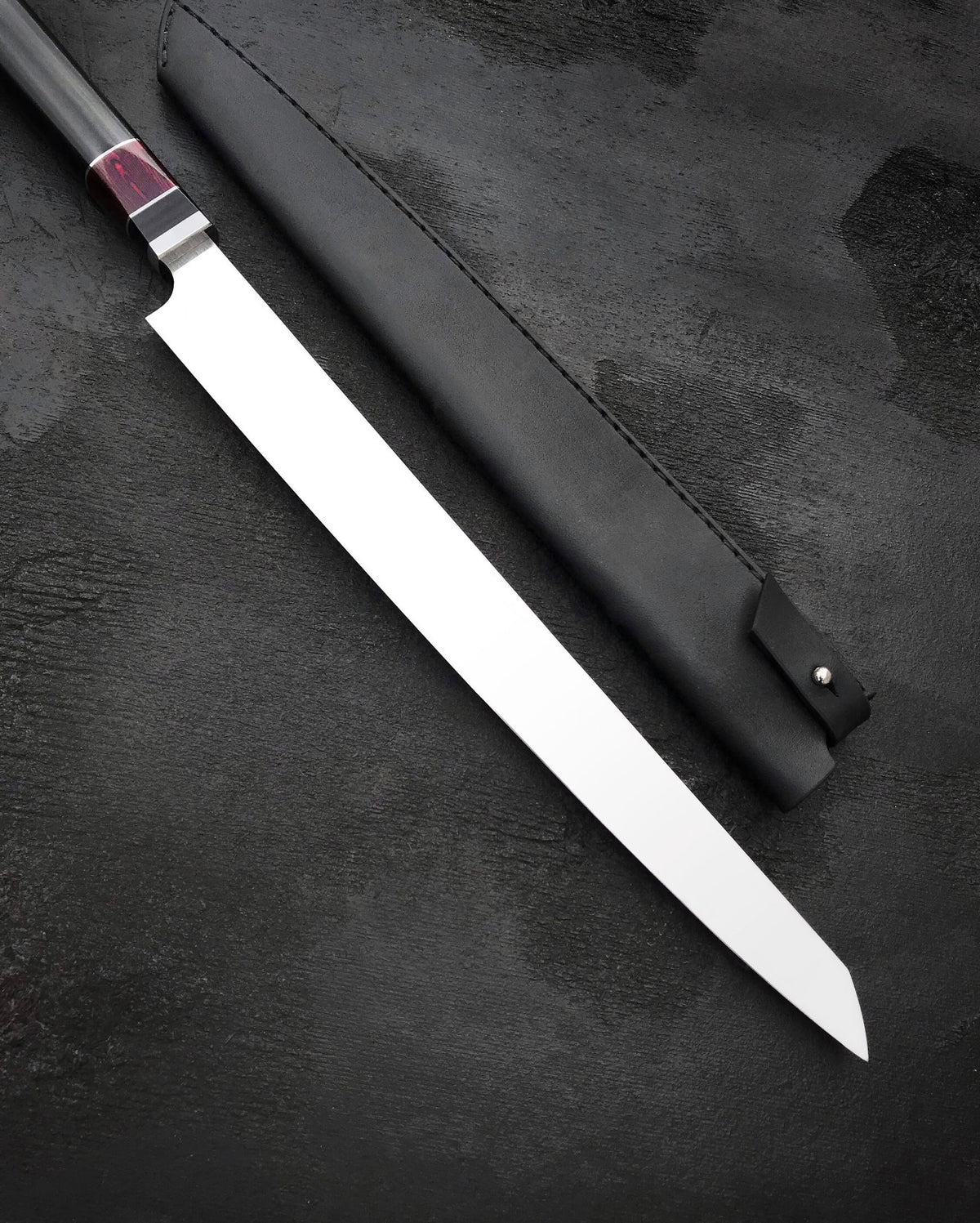 Black stitched leather knife sheath with snap strap for a long slicing knife
