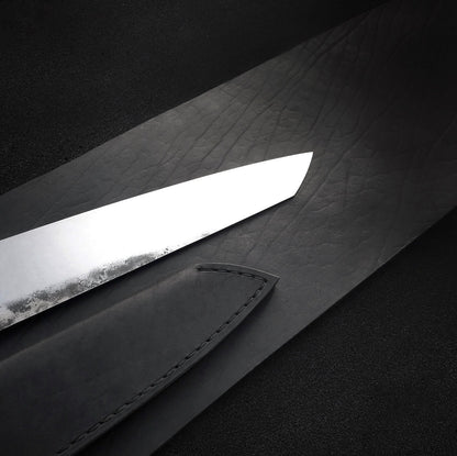 Black leather knife sheath with stitched edge and retaining strap with snap
