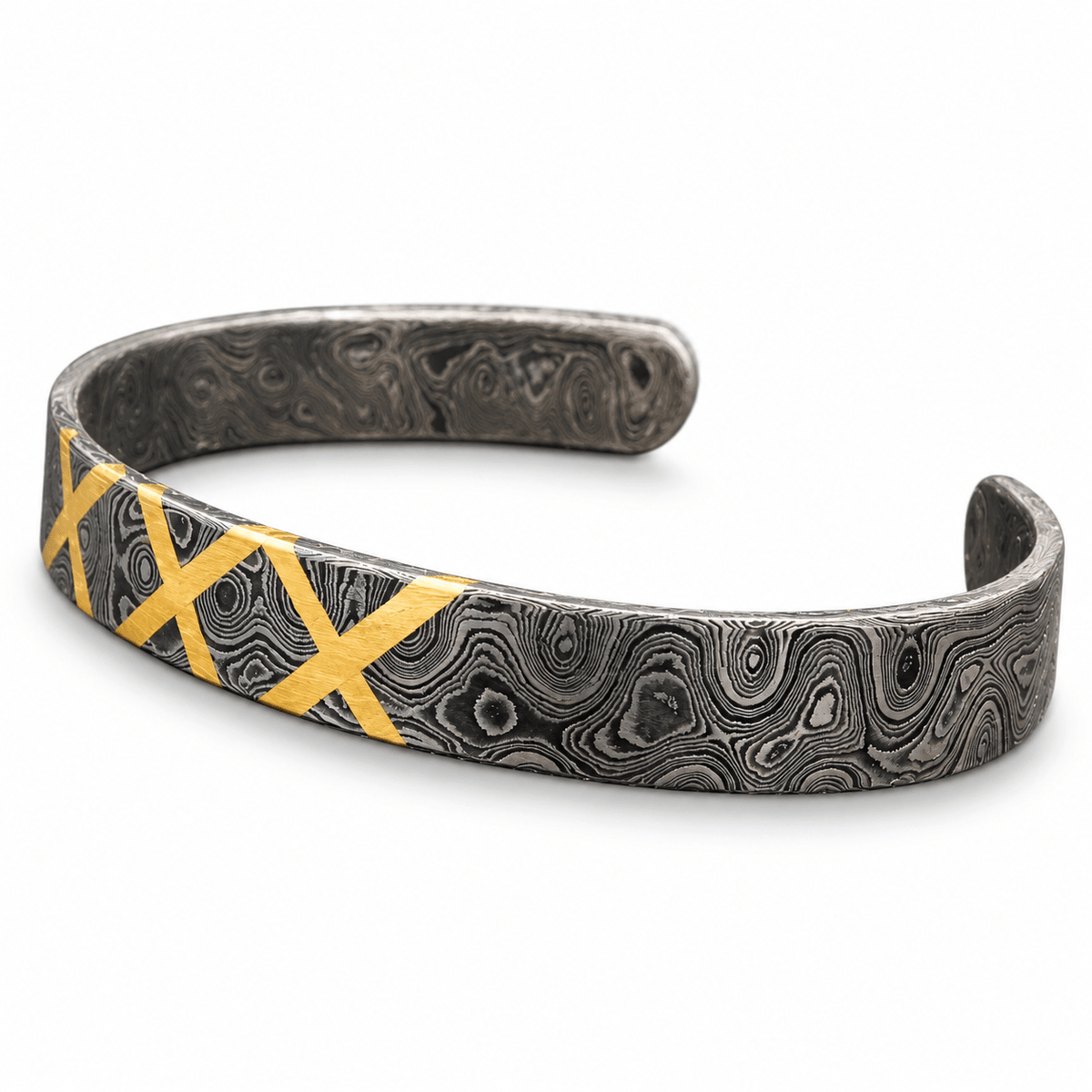 Open Damascus cuff bracelet showing ringed pattern on the inner surface