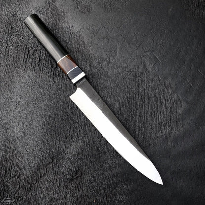 Slicer knife with slim 440C blade and octagonal Micarta and wood handle on black textured surface
