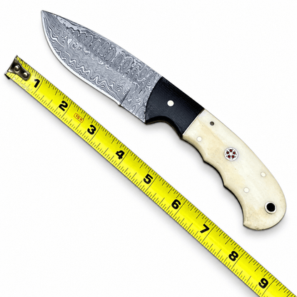 Small fixed blade knife with rippling Damascus pattern and black front section

