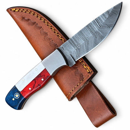 Texas flag skinner knife with Damascus blade and red, white and blue handle
